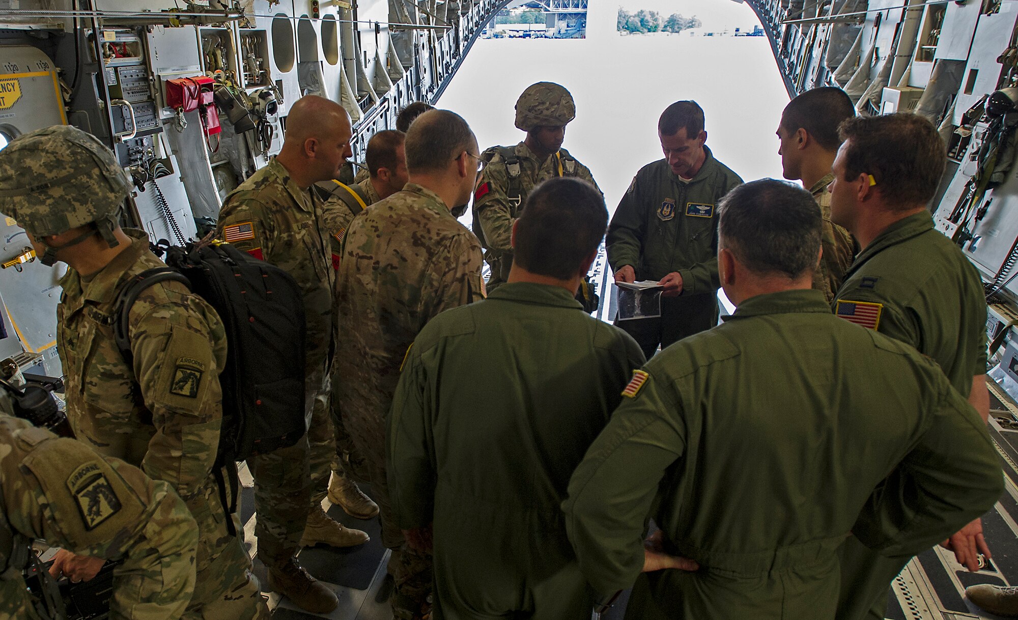 315th Operations Group Commander, Lt. Col. John Robinson give Army jumpmasters a pre-jump briefing before they take off for their drop zone at Fort Bragg, N.C. About 1,600 paratroopers from the 82nd Airborne Division packed 18 C-17 Globemaster IIIs from Joint Base Charleston, S.C. en-route to a a Fort Bragg, N.C. airdrop May 25. (U.S. Air Force Photo / Master Sgt, Shane Ellis)