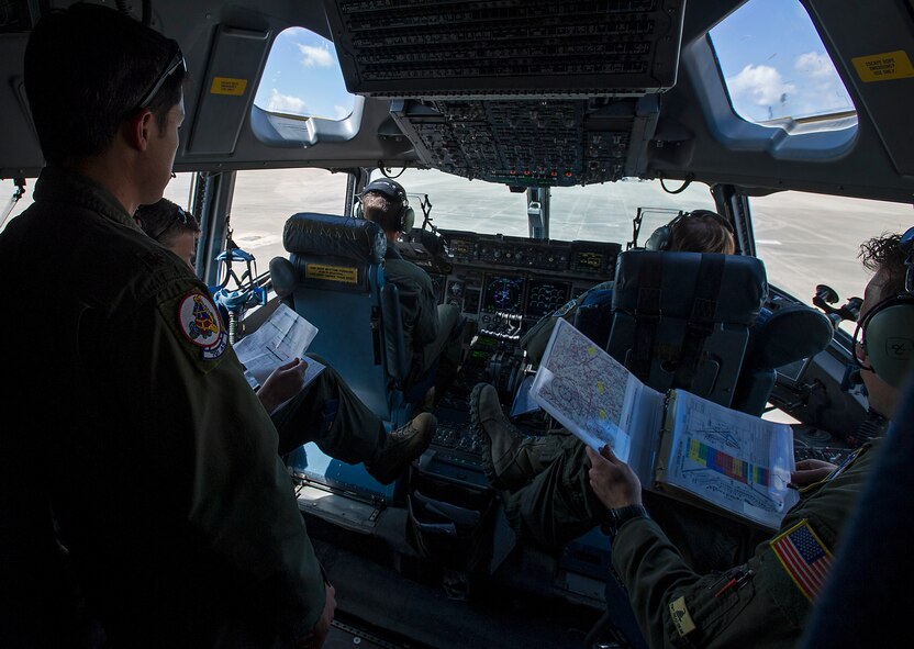 A 701st Airlift Squadron aircrew prepares to take off from Pope Army Airfield after parartroopers boarded their Charleston-based C-17 enroute to a drop zone at Fort Bragg, N.C. About 1,600 paratroopers from the 82nd Airborne Division packed 18 C-17 Globemaster IIIs from Joint Base Charleston, S.C. en-route to a a Fort Bragg, N.C. airdrop May 25. (U.S. Air Force Photo / Master Sgt, Shane Ellis)