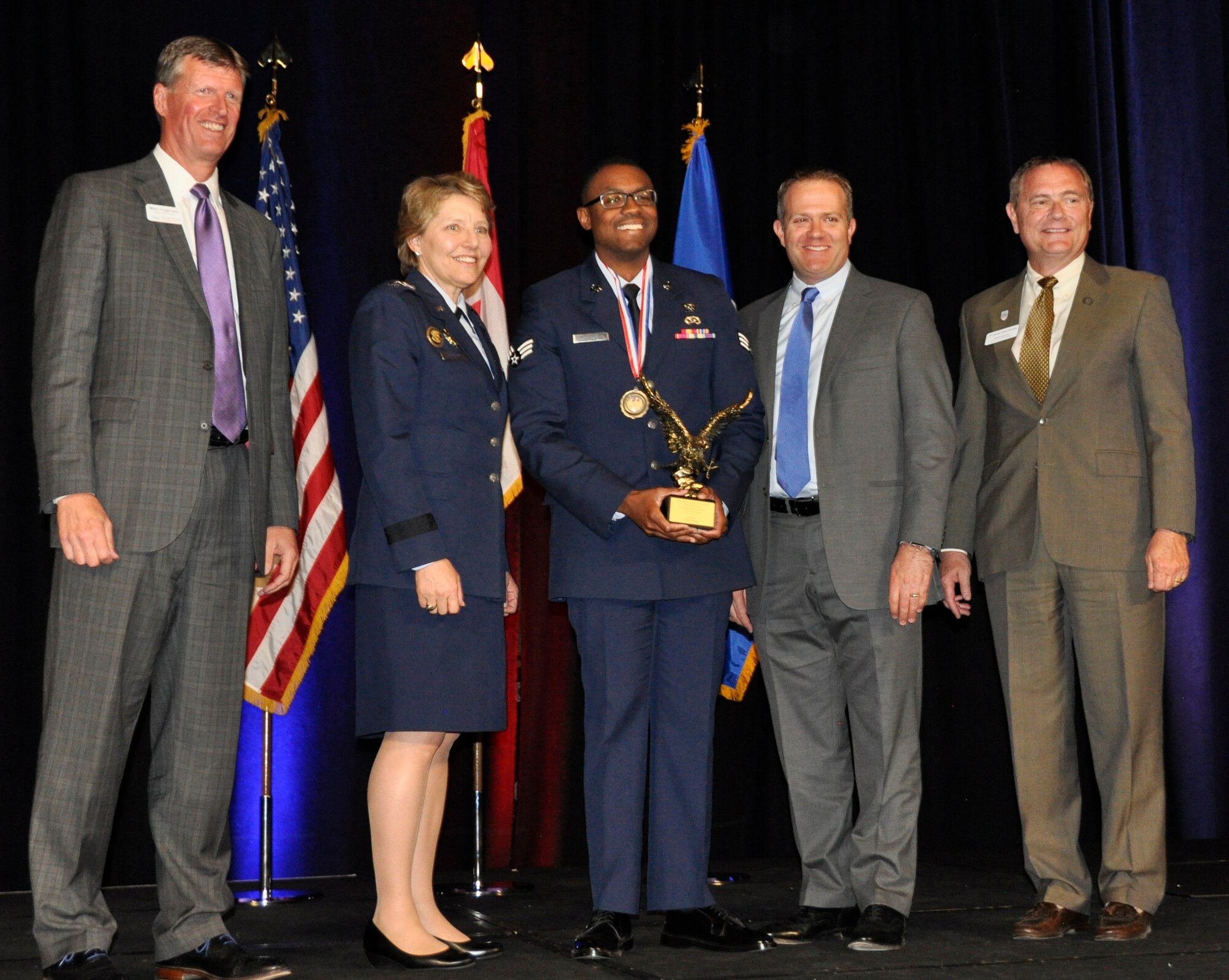 Senior Airman Elliott Jones, a traditional Air Force reservist and emergency management specialist assigned to the 302nd Civil Engineer Squadron, was awarded the Outstanding Enlisted Military Member E-1 through E-4 category by the Colorado Springs Military Affairs Council. The award, which recognizes outstanding military and community achievements was presented by Lt. Gen. Michelle Johnson, superintendent of the U.S. Air Force Academy and members of the Colorado Springs Chamber of Commerce Military Affairs Council during the Chamber's annual Armed Forces Week awards luncheon. (U.S. Air Force photo/Ann Skarban)