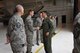 Maj. Gen. Marc Sasseville, Deputy Director of the Air National Guard, coins Airman First Class Chris Von Haasl, 140th Maintenance Group, during his visit to Buckley Air Force Base May 7. (U.S. Air National Guard photo by Staff Sgt. Michelle Alvarez-Rea)