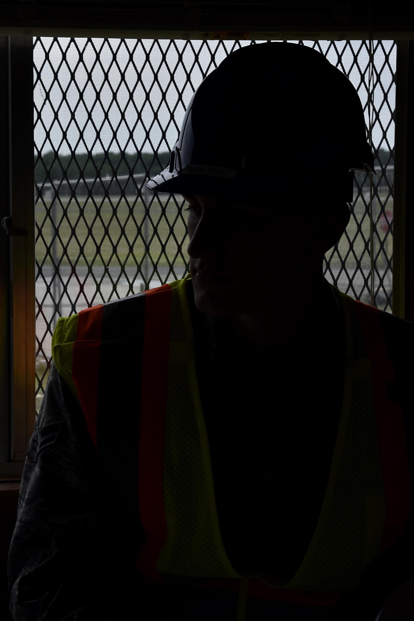 Airman 1st Class Zachary Free, 175th Civil Engineering Squadron, waits inside a trailer at a construction site May 24, 2017 at Warfield Air National Guard Base, Middle, River, Md. Free uses the trailer as an office to go over blueprints and a location to rest on overnight shifts. (U.S. Air National Guard photo by Airman Sarah M. McClanahan /Released Master Sgt. Chris Schepers)