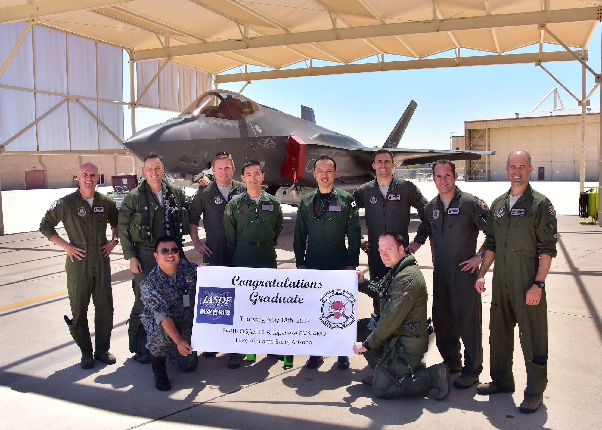 Members from the 944th Operations Group Detachment 2 “Ninjas” and Japan Air Self-Defense Force, pose for a photo May 18 after the graduating JASDF F-35 pilot’s final flight here at Luke Air Force Base, Ariz. (U.S. Air Force photo by Tech. Sgt. Louis Vega Jr.)