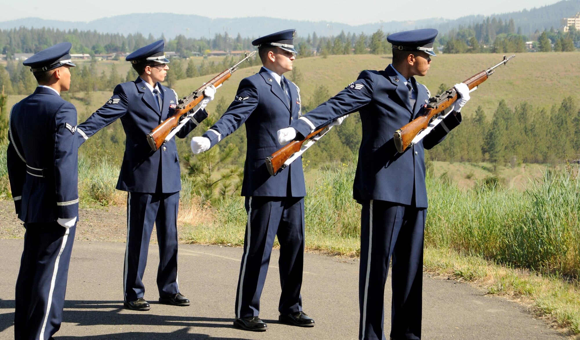 Members of the Fairchild Air Force Base Honor Guard perform a three-shot salute during a Memorial Day ceremony at Fort George Wright Cemetery May 29, 2017. The ceremony honored service members who have died. Memorial Day officially became a federal holiday in 1967. (U.S. Air Force photo by Master Sgt. J.G. Buzanowski)