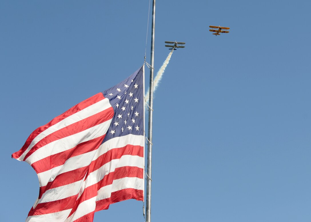 Stearman biplanes perform a flyover during a Memorial Day ceremony at Washington State Veterans Cemetery May 29, 2017. The ceremony featured live patriotic music, wreath presentations and other events to honor service members who have lost their lives. Col. Ryan Samuelson, 92nd Air Refueling Wing commander, was the guest speaker. (U.S. Air Force photo/ Master Sgt. J.G. Buzanowski)