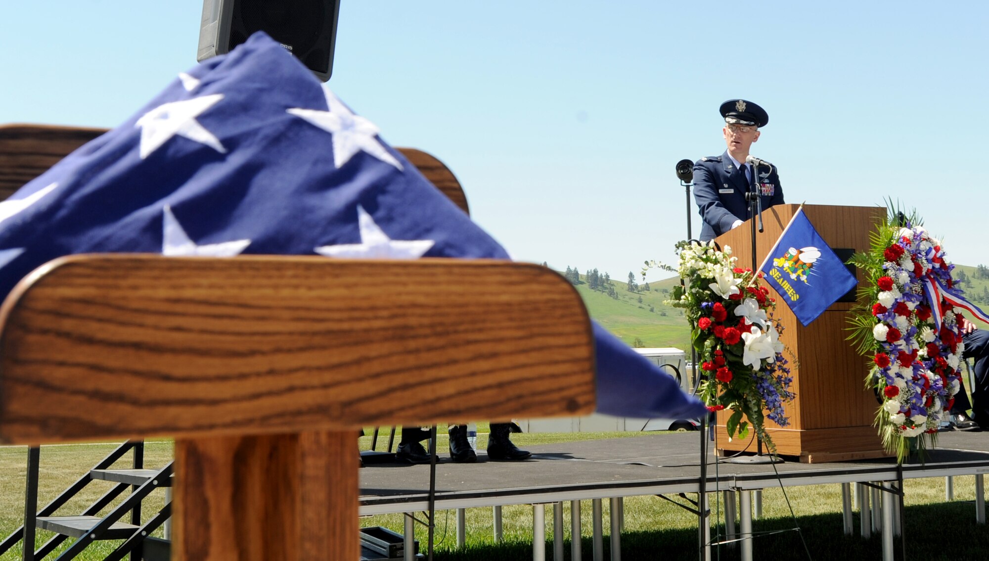 Col. Ryan Samuelson, 92nd Air Refueling Wing commander, addresses several hundred people during a Memorial Day ceremony at Washington State Veterans Cemetery May 29, 2017. The ceremony featured live patriotic music, wreath presentations and other events to honor service members who have lost their lives. (U.S. Air Force photo by Master Sgt. J.G. Buzanowski)