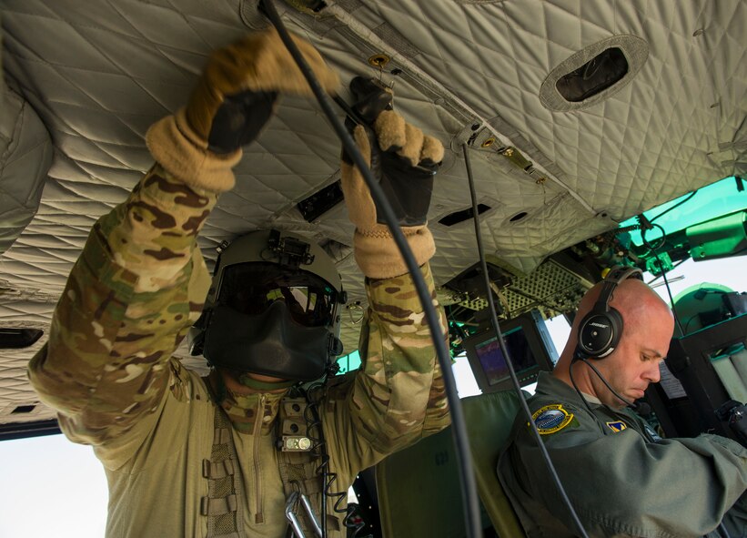 Tech. Sgt. Jamie Aulbach, 54th Helicopter Squadron flight engineer, prepares pre-flight communication lines in the missile complex, N.D., May 23, 2017. The lines and headsets allow for easy communication between pilots, FEs and passengers during flights. (U.S. Air Force photo/Senior Airman Apryl Hall)