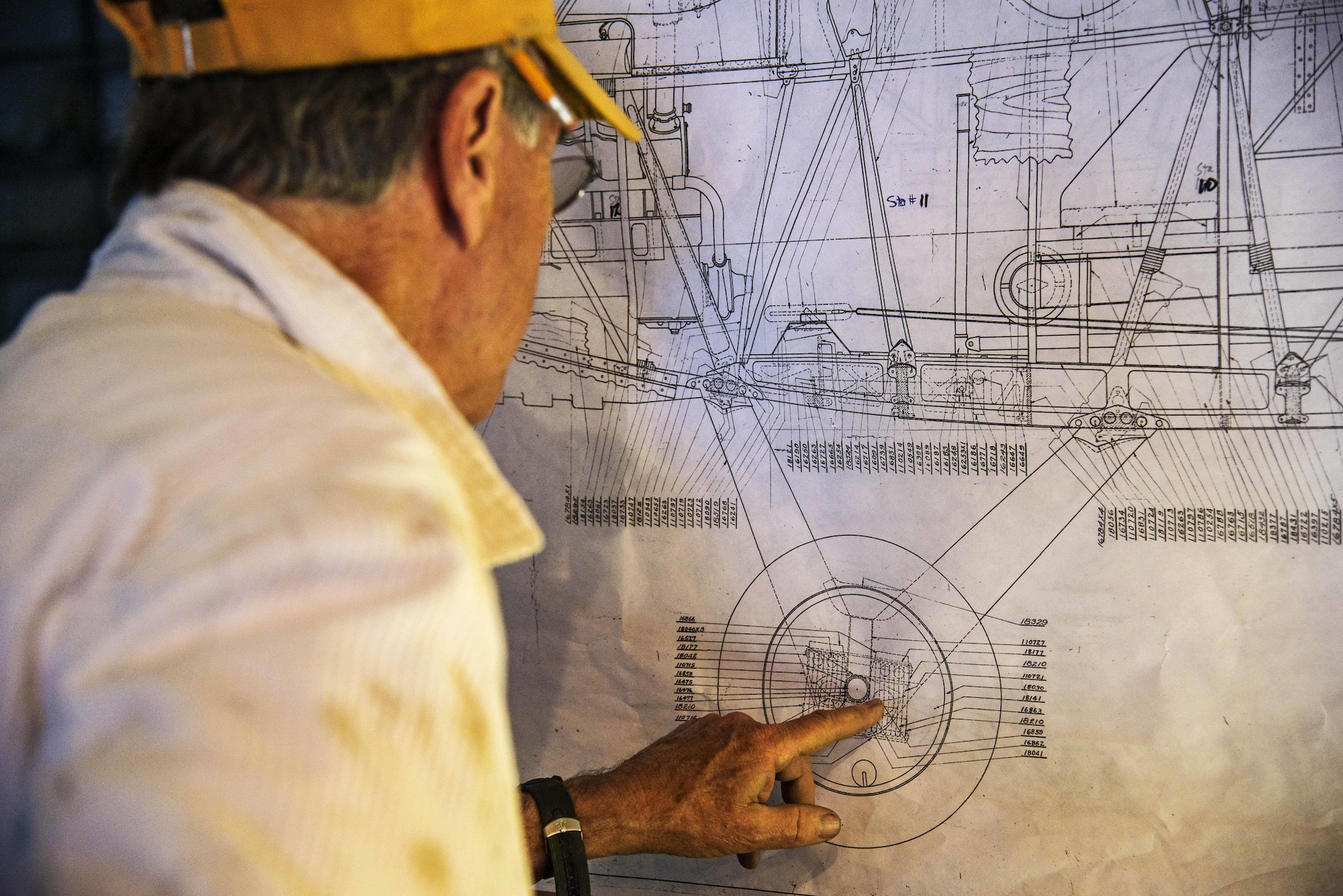 Dorian Walker, Chairman of Friends of Jenny, looks over and studies blueprints, May, 4, 2017 at Bowling Green, Kentucky. FOJ's mission was to build a Jenny-but to build it to fly. They wanted to do it in a short amount of time and not spend anywhere from 7 to 20 years building it and it not fly, so 5,720 hours later, over the course of 14 months, three teams of individuals built the Jenny. (U.S. Air Force photo/Senior Airman Tristin English)