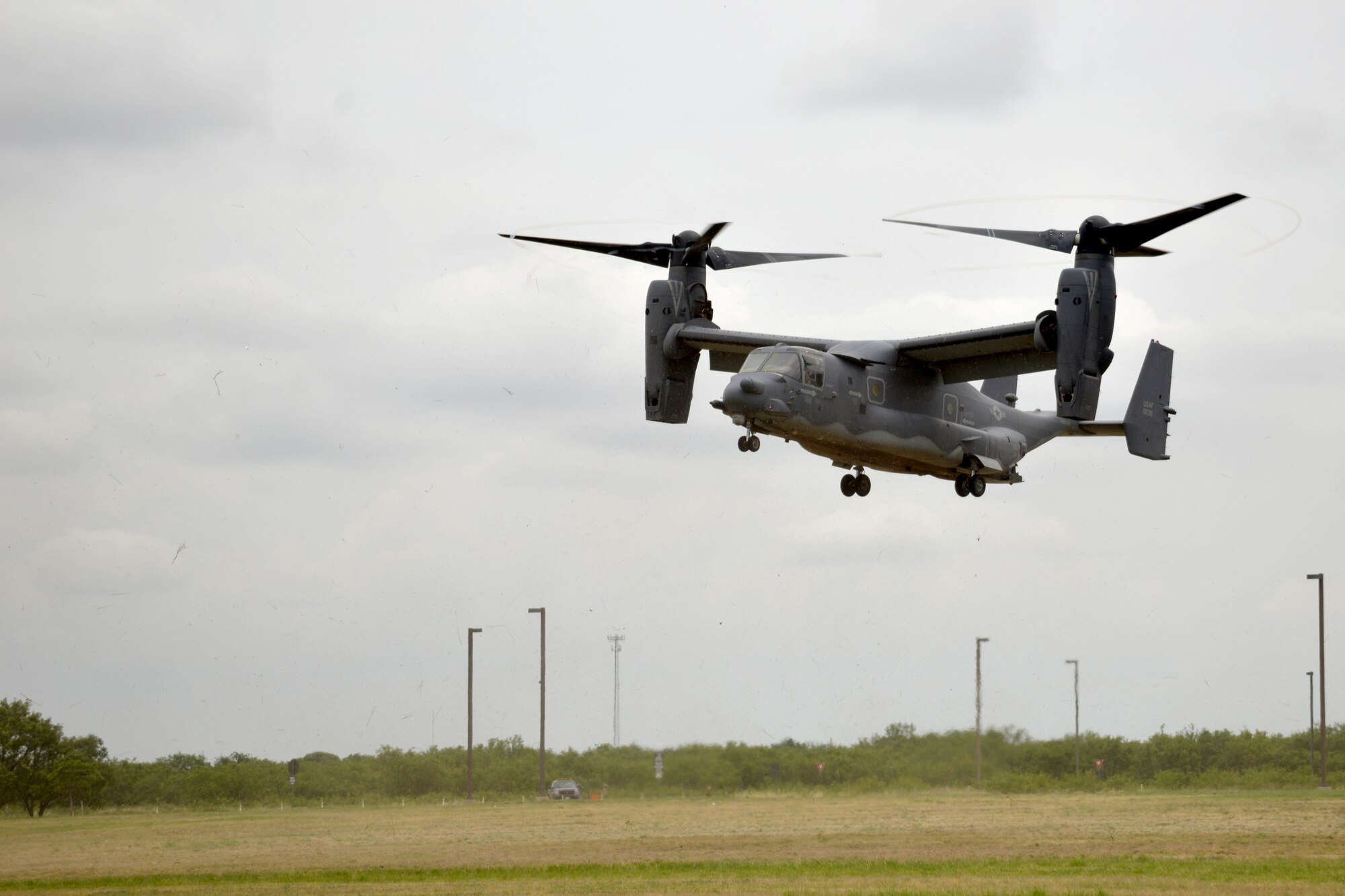 A CV-22 Osprey from the 20th Cannon Air Force Base, New Mexico, lands on Goodfellow Air Force Base, Texas, May 30, 2017. The Osprey brought intelligence personnel from the 20th Operations Squadron back to Goodfellow to give students first-hand experience of the operational Air Force. (U.S. Air Force photo by Airman 1st Class Randall Moose/Released)