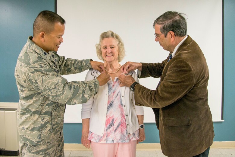 Karen Bunch, Cyberspace Support Squadron mission readiness training manager, receives commemorative pins to celebrate 50 years of dedicated service to the Air Force during a Wingman Day luncheon at Scott Air Force Base, Illinois, May 12, 2017. Karen Bunch was honored during a Wingman Day luncheon for the Cyberspace Support Squadron at Scott Air Force Base, Illinois, May 12, 2017. Since 1967 Bunch has worked for the Air Force including Headquarters Mobility Air Command, Air Force Communications Service, Air Force Network Integration Center and Air FOrce Communications Agency. (U.S. Air Force photo by Airman 1st Class Daniel Garcia)