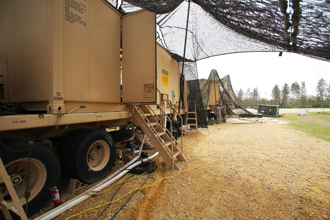 Soldiers with the 810th Quartermaster Company of Cincinnati, Ohio, operate a Reverse-Osmosis Water Purification Unit at Big Sandy Lake on May 10, 2017, during operations for the 86th Training Division’s Warrior Exercise 86-17-02 at Fort McCoy, Wis. The Warrior Exercise provides unique training opportunities for various Soldiers in various military occupation specialties to train together on simulated combat missions and to work together as a team, just like they would in a real-world environment. The 810th provided the majority of the drinkable water used in the exercise through water-purification efforts. (U.S. Army Photo by Scott T. Sturkol, Public Affairs Office, Fort McCoy, Wis.)