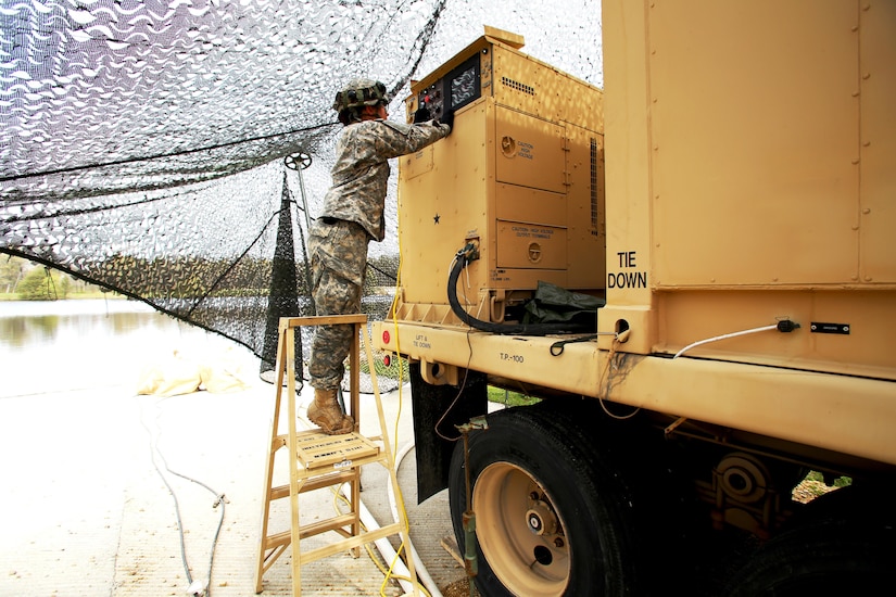 Pfc. Makayla Black with the 810th Quartermaster Company of Cincinnati, Ohio, checks the generator for a Reverse-Osmosis Water Purification Unit at Big Sandy Lake on May 10, 2017, during operations for the 86th Training Division’s Warrior Exercise 86-17-02 at Fort McCoy, Wis. The Warrior Exercise provides unique training opportunities for various Soldiers in various military occupation specialties to train together on simulated combat missions and to work together as a team, just like they would in a real-world environment. The 810th provided the majority of the drinkable water used in the exercise through water-purification efforts. (U.S. Army Photo by Scott T. Sturkol, Public Affairs Office, Fort McCoy, Wis.)