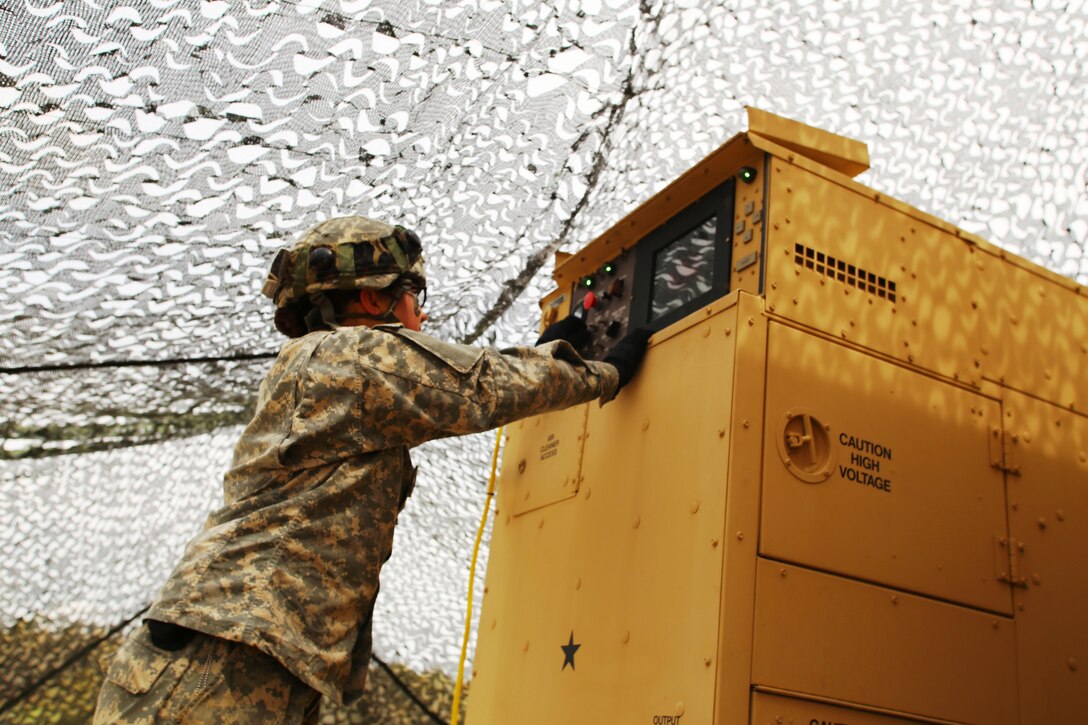 Pfc. Makayla Black with the 810th Quartermaster Company of Cincinnati, Ohio, checks the generator for a Reverse-Osmosis Water Purification Unit at Big Sandy Lake on May 10, 2017, during operations for the 86th Training Division’s Warrior Exercise 86-17-02 at Fort McCoy, Wis. The Warrior Exercise provides unique training opportunities for various Soldiers in various military occupation specialties to train together on simulated combat missions and to work together as a team, just like they would in a real-world environment. The 810th provided the majority of the drinkable water used in the exercise through water-purification efforts. (U.S. Army Photo by Scott T. Sturkol, Public Affairs Office, Fort McCoy, Wis.)