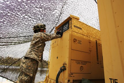 Pfc. Makayla Black with the 810th Quartermaster Company of Cincinnati, Ohio, checks the generator for a Reverse-Osmosis Water Purification Unit at Big Sandy Lake on May 10, 2017, during operations for the 86th Training Division’s Warrior Exercise 86-17-02 at Fort McCoy, Wis. The Warrior Exercise provides unique training opportunities for various Soldiers in various military occupation specialties to train together on simulated combat missions and to work together as a team, just like they would in a real-world environment. The 810th provided the majority of the drinkable water used in the exercise through water-purification efforts. (U.S. Army Photo by Scott T. Sturkol, Public Affairs Office, Fort McCoy, Wis.)