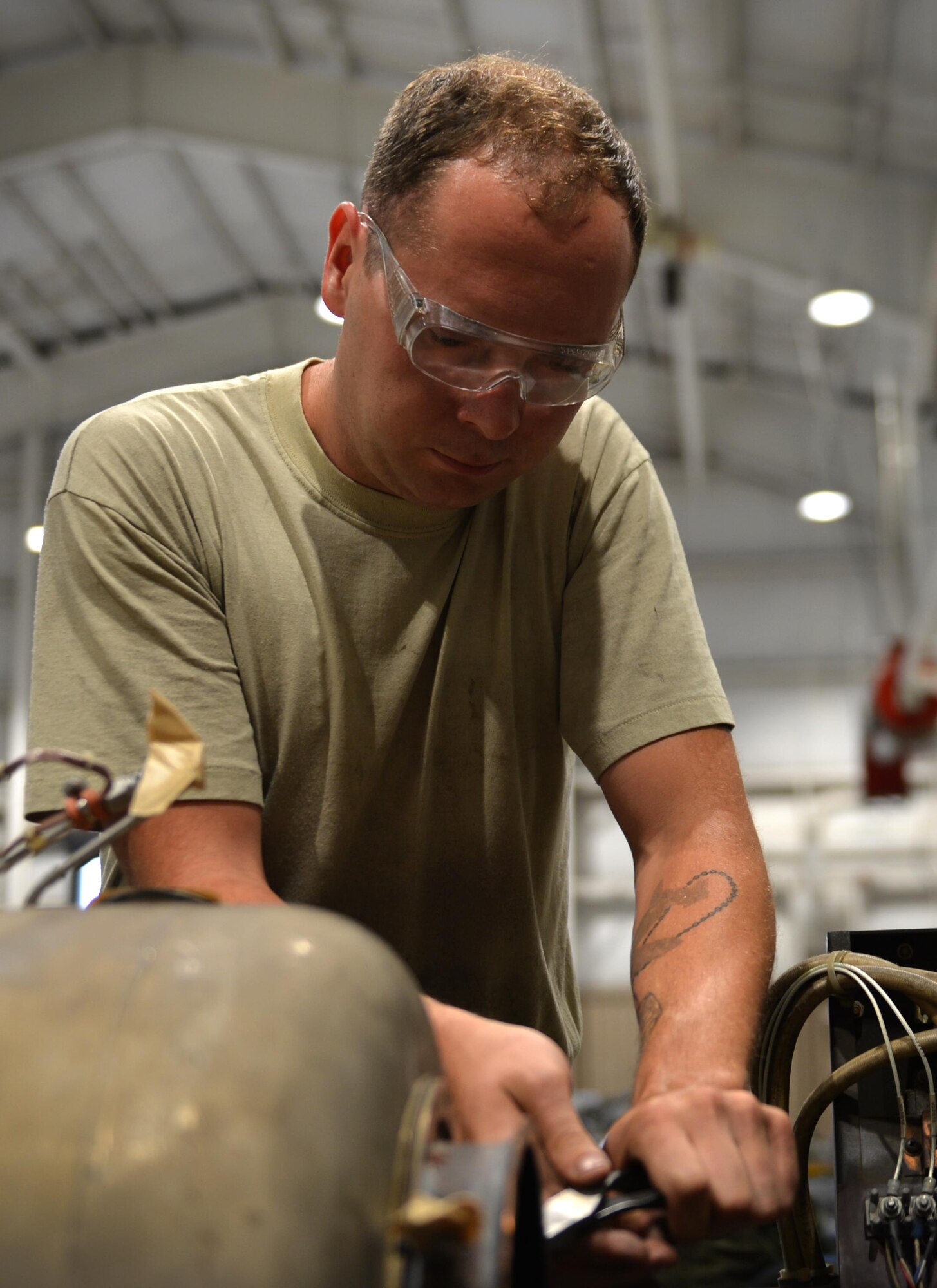 U.S. Air Force Senior Airmen Stephen Kelly, 20th Equipment Maintenance Squadron aerospace ground equipment (AGE) journeyman, removes the final bolt from an A/M32A-60 generator motor at Shaw Air Force Base, S.C., May 24, 2017. Airmen assigned to the AGE flight utilize an array of tools to repair generators, bomb loaders and other pieces of equipment needed to complete flightline operations. (U.S. Air Force photo by Airman 1st Class Christopher Maldonado)