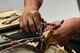 U.S. Air Force Senior Airman Stephen Kelly, 20th Equipment Maintenance Squadron aerospace ground equipment (AGE) journeyman, removes a bolt from an A/M32A-60 generator at Shaw Air Force Base, S.C., May 24, 2017. Airmen assigned to the AGE flight are trained to identify and correct mechanical errors in aircraft maintenance equipment such as generators and bomb loaders. (U.S. Air Force photo by Airman 1st Class Christopher Maldonado)