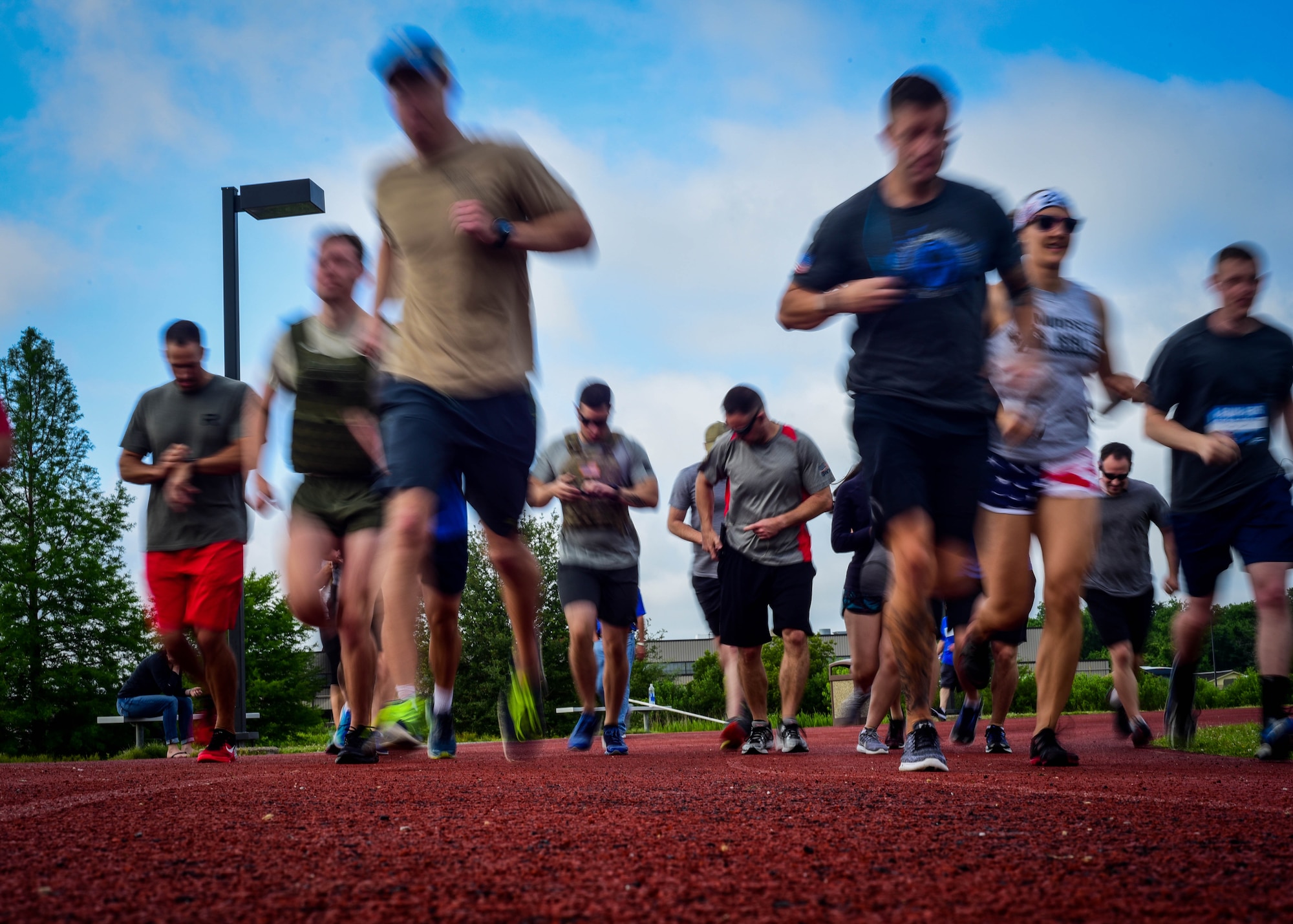 U.S. service members and their families begin a 1-mile run during a Memorial Day Murph and Pararescue Workout event at Joint Base Langley-Eustis, Va., May 29, 2017. The event included a variety of exercises and aimed to remember those who made the ultimate sacrifice for their country (U.S. Air Force photo/Staff Sgt. Areca T. Bell)