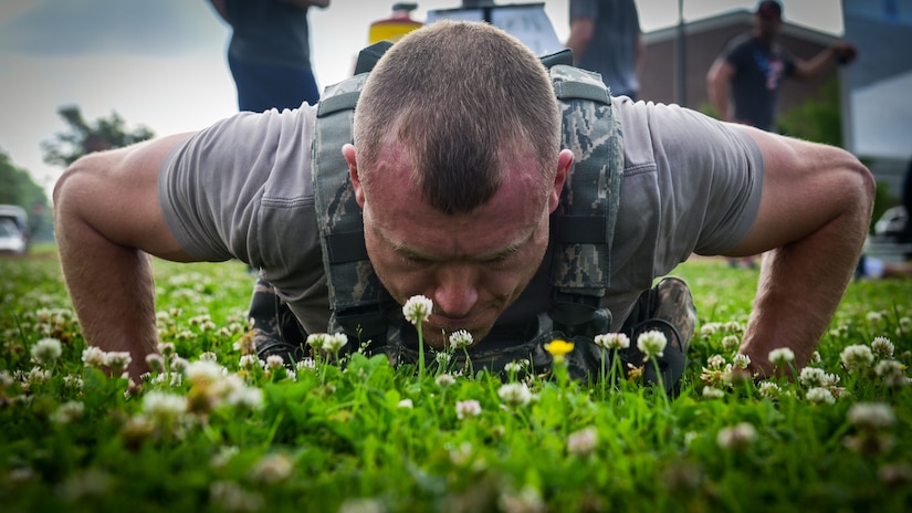 U.S. Air Force Tech. Sgt. Jared Martin, 633rd Security Forces Squadron police services NCO in charge, performs a push-up during a Memorial Day Murph and Pararescue Workout event at Joint Base Langley-Eustis, Va., May 29, 2017. During the event, participants performed a number of exercises in remembrance of those who made the ultimate sacrifice for their country. (U.S. Air Force photo/Staff Sgt. Areca T. Bell)