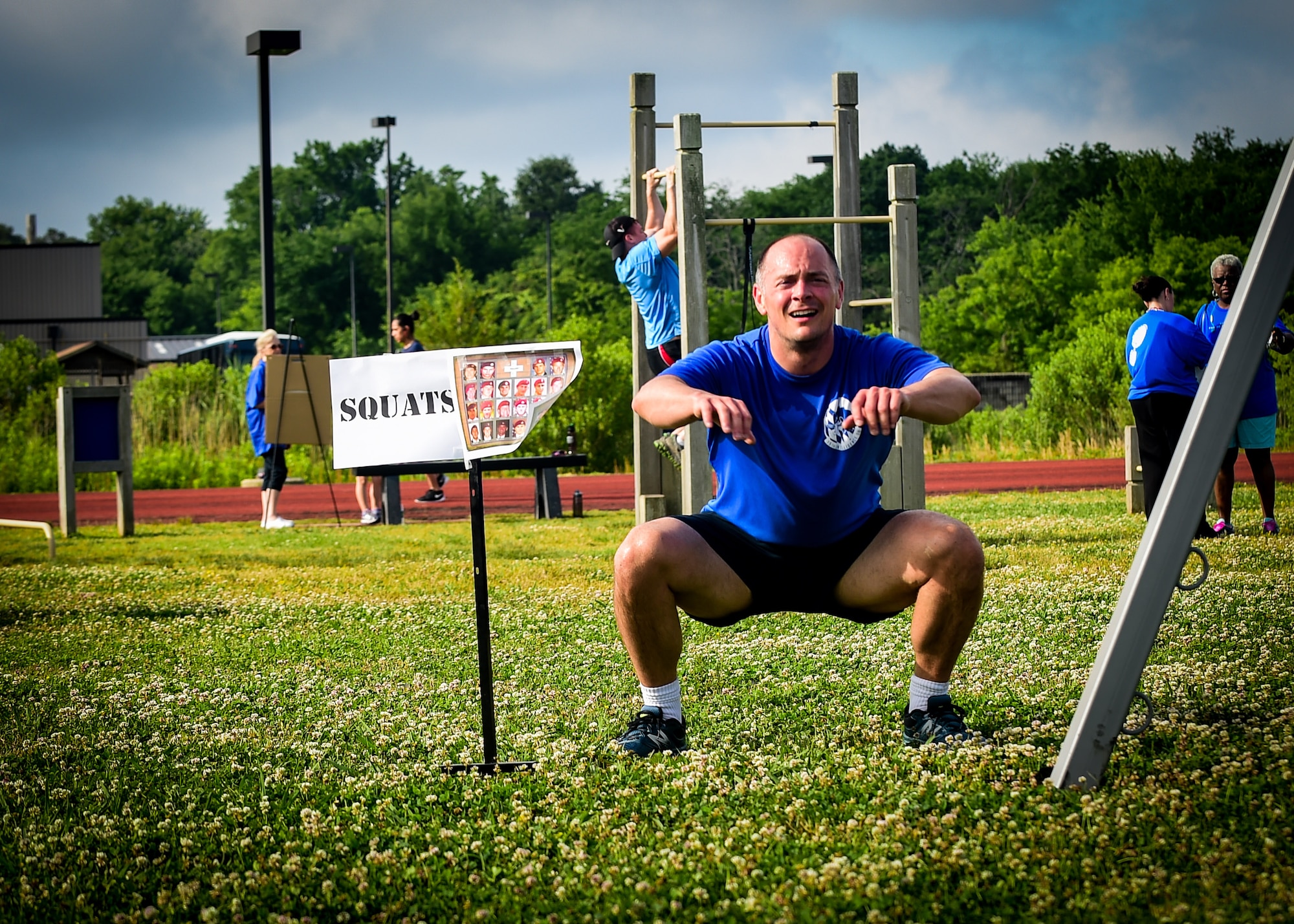 A participant does a squat during a Memorial Day Murph and Pararescue Workout event at Joint Base Langley-Eustis, Va., May 29, 2017. The event included a variety of exercises aimed to remember those who made the ultimate sacrifice. (U.S. Air Force photo/Staff Sgt. Areca T. Bell)