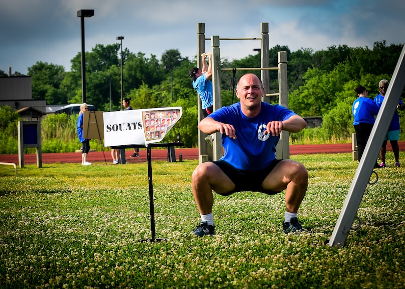 A participant does a squat during a Memorial Day Murph and Pararescue Workout event at Joint Base Langley-Eustis, Va., May 29, 2017. The event included a variety of exercises aimed to remember those who made the ultimate sacrifice. (U.S. Air Force photo/Staff Sgt. Areca T. Bell)