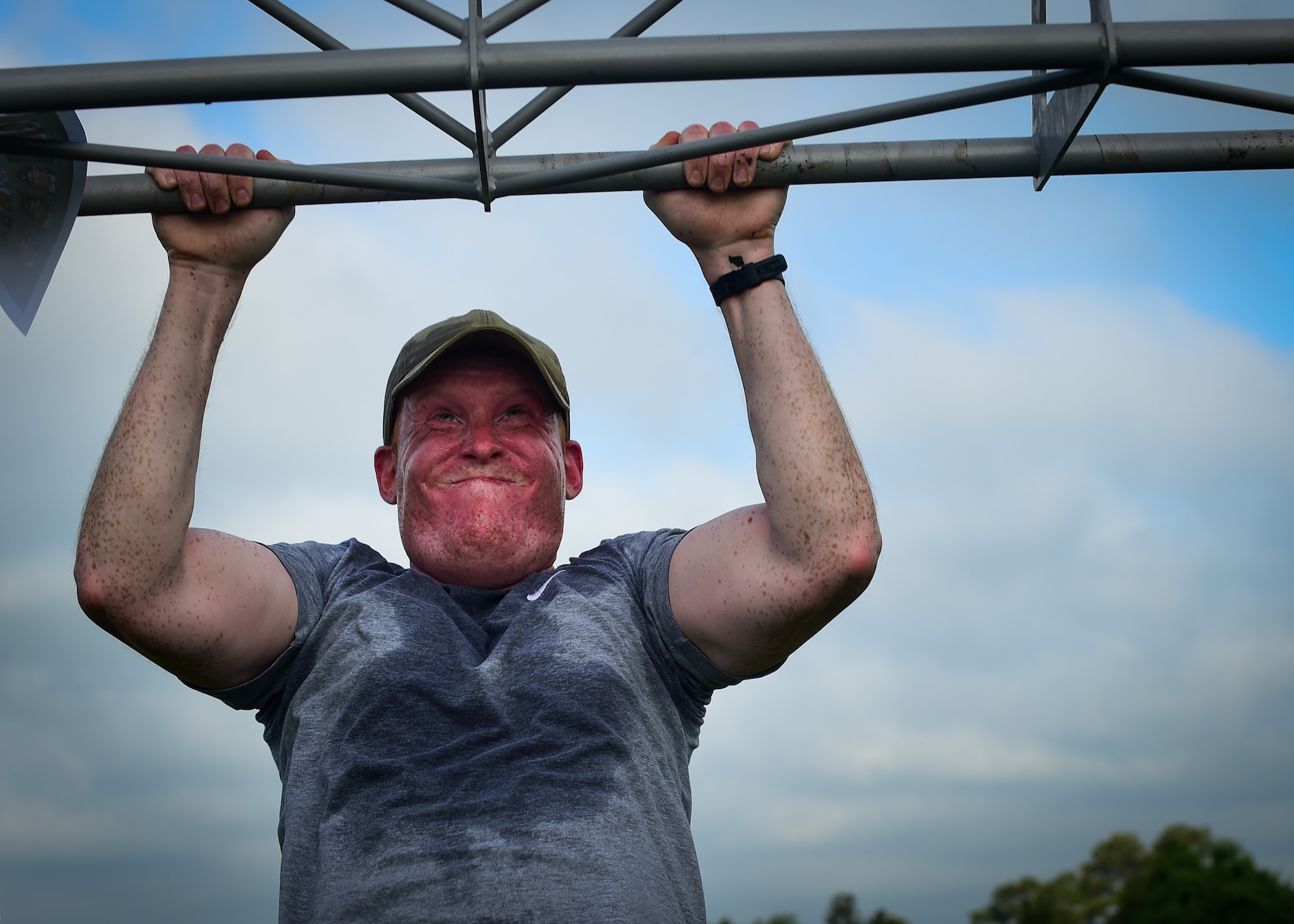 U.S. Air Force Staff Sgt. Holden, assigned to the 30th Intelligence Squadron, does a pull-up during a Memorial Day Murph and Pararescue Workout event at Joint Base Langley-Eustis, Va., May 29, 2017. Participants who participated in the Pararescue Workout ran a total of two miles, performed a total of 100 pullups, 400 burpees, 300 squats, 100 sit-ups and 400-meter tire flip. (U.S. Air Force photo/Staff Sgt. Areca T. Bell)(Last name withheld for security purposes)