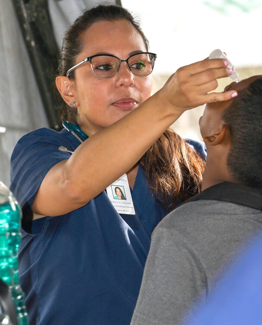 Herlly Camacho, a Masters of Nursing student of Florida International University, administers eye drops to a patient in San Ignacio, Belize, May 11, during a medical readiness training event hosted by the U.S. Army field training exercise Beyond the Horizon 2017. Camacho and three of her classmates and one of her clinical professors from FIU volunteered to assist U.S. Army medical personnel administer free healthcare, as a means of broadening their horizons. BTH 2017 is a U.S. Southern Command-sponsored, Army South-led exercise designed to provide humanitarian and engineering services to communities in need, demonstrating U.S. support for Belize.