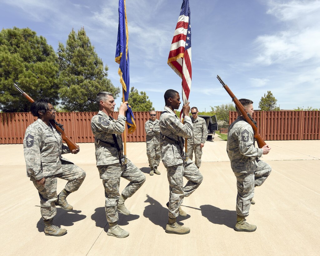 U.S. Air Force Chief Master Sgts. Michelle Browning, left, 7th Force Support Squadron superintendent, Raymond Mott, 7th Bomb Wing command chief, and Antonio Goldstrom, 7th Mission Support Group superintendent, march with Airman 1st Class Londun Dyer, 7th Bomb Wing Dyess Honor Guardsman, during a flag detail practice at Dyess Air Force Base, Texas, April 4, 2017. Four Dyess chiefs were trained by Dyess Honor Guardsmen to demonstrate the importance of military funeral honors and ceremonies and provide a unique aspect of leading from the front. (U.S. Air Force photo by Senior Airman Kedesha Pennant)
