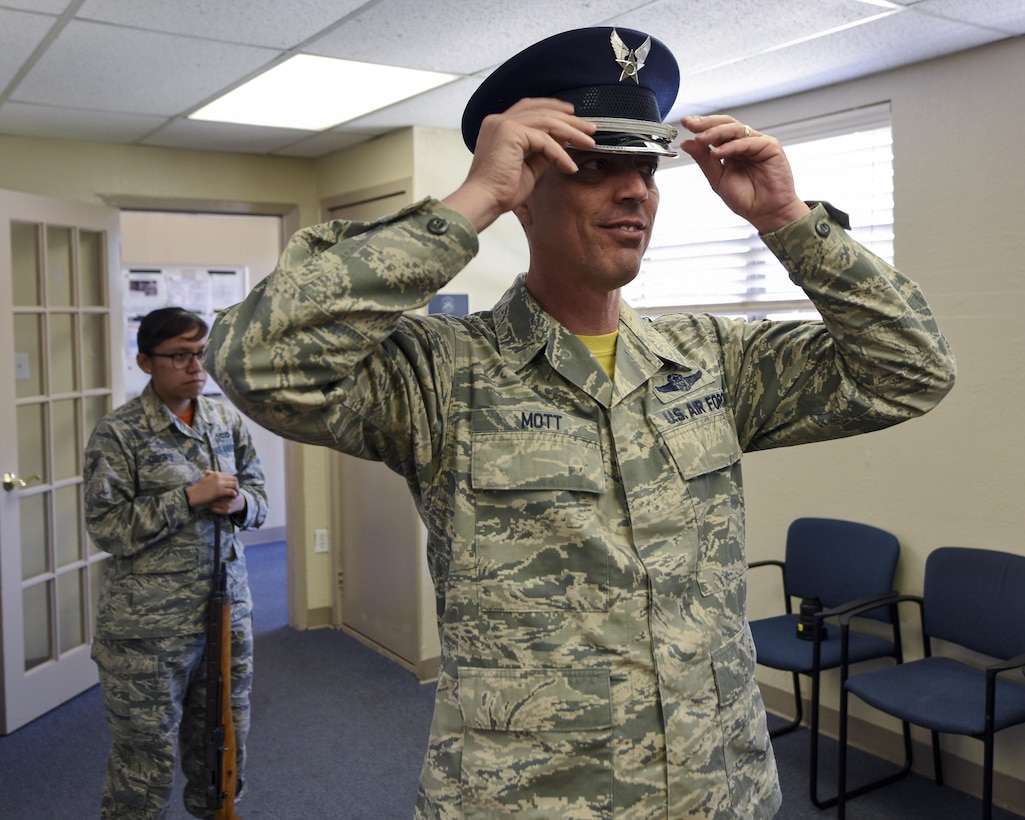 U.S. Air Force Chief Master Sgt. Raymond Mott, 7th Bomb Wing command chief, tries on a Gen. Hap Arnold dress hat at Dyess Air Force Base, Texas, April 7, 2017. Mott enlisted other chief master sergeants to join him in receiving formal training from the Dyess Honor Guard, which included getting fitted for ceremonial uniforms.