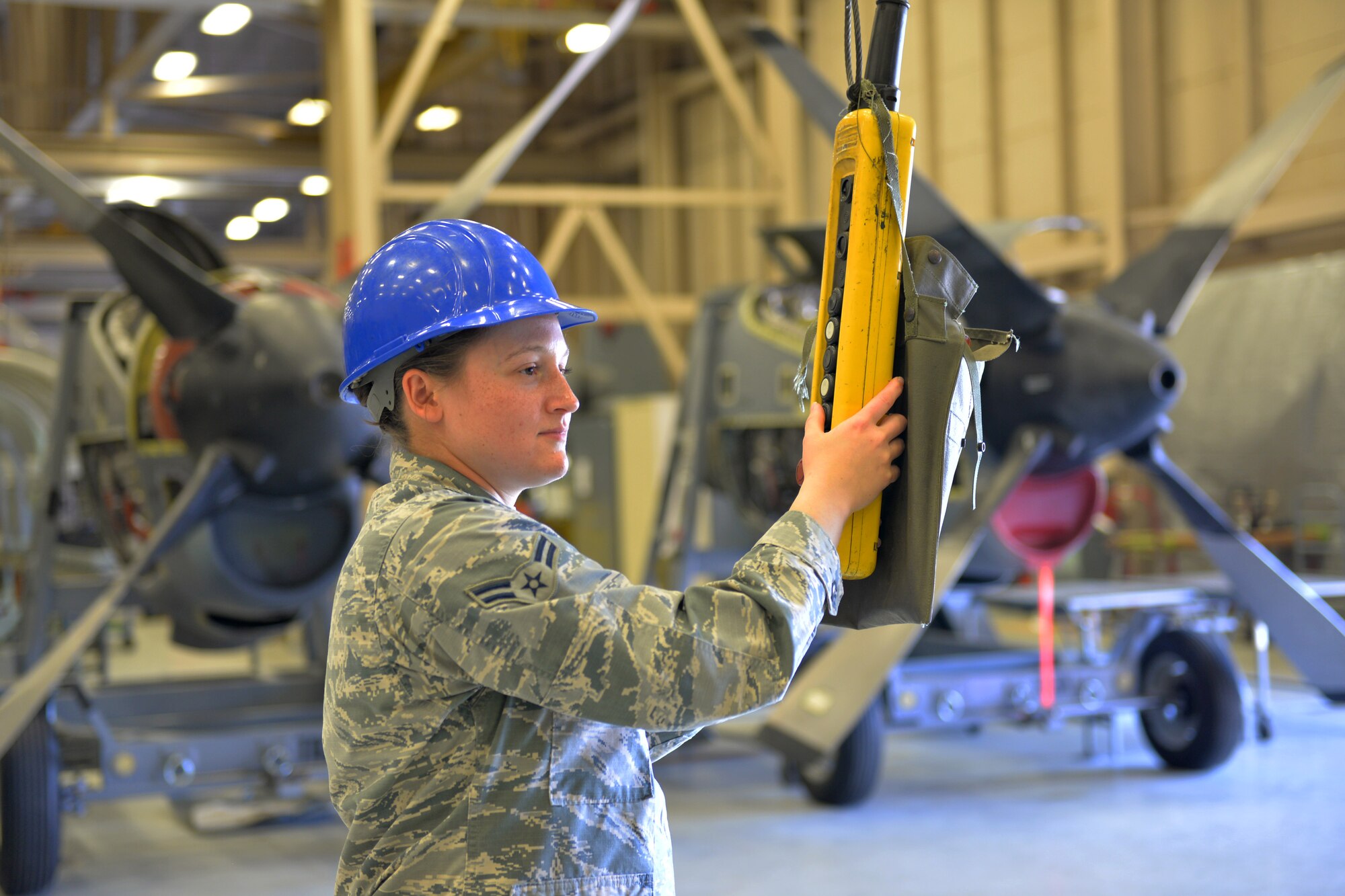 Airman Bridie Eckenrode, 361st Training Squadron student, installs a propeller retaining nut onto a T-56 Rolls Royce turboprop engine at Sheppard Air Force Base, Texas, May 24, 2017. This model propeller and engine combination are installed onto the C-130H aircraft. (U.S. Air Force photo by Liz H. Colunga/Released)
