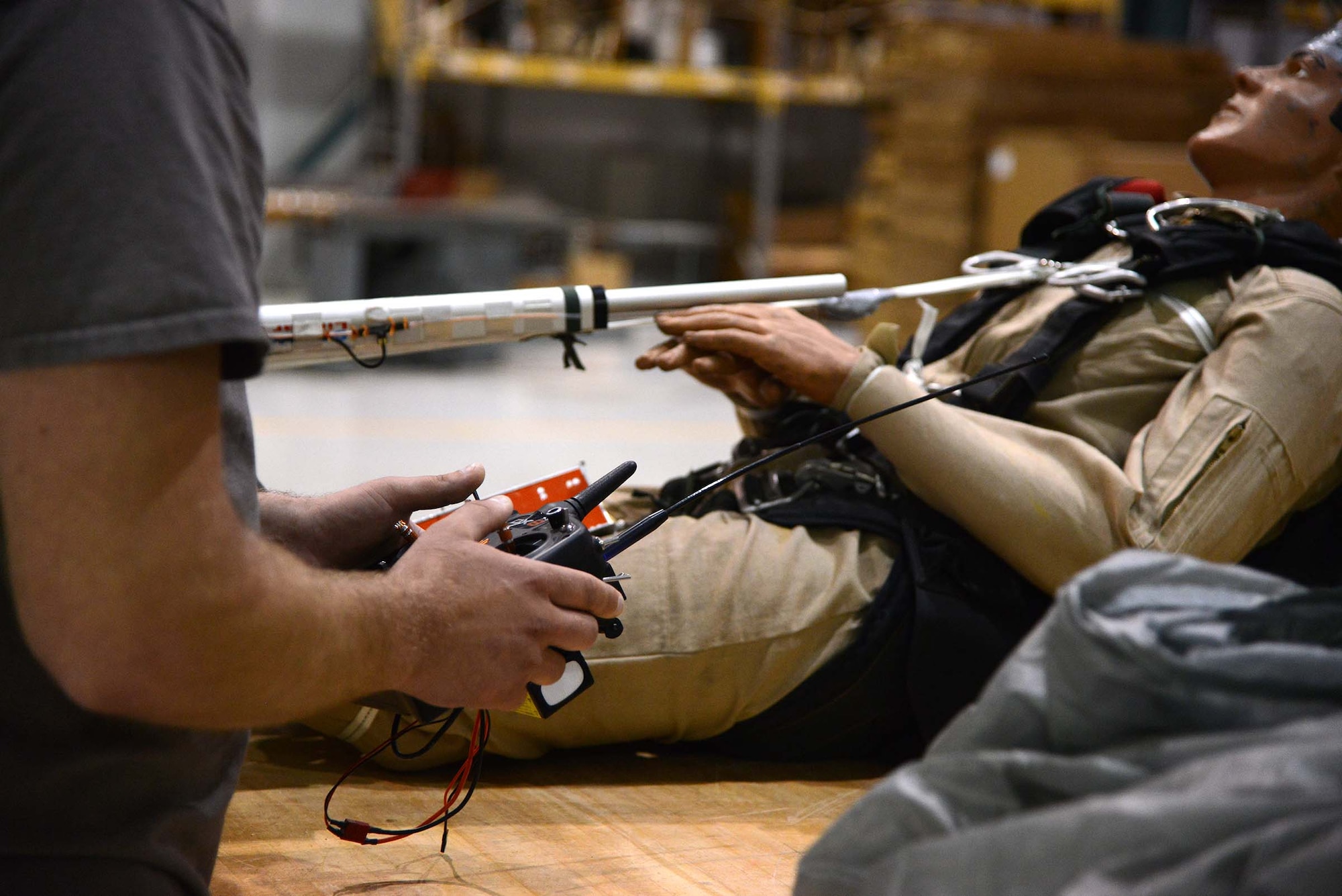 Trever Bush, 412th OSS Parachute Test Team, demonstrates the operation of the Remotely Piloted Parachute System he designed and built. The RPPS is designed to save time and money in recovery and dummy repair costs during parachute testing. (U.S. Air Force photo by Christopher Ball)