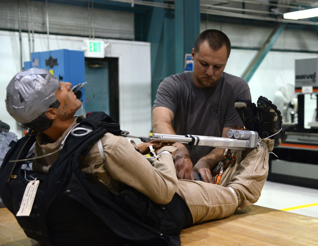 Trever Bush, 412th OSS Parachute Test Team, demonstrates the operation of the Remotely Piloted Parachute System he designed and built. The RPPS is designed to save time and money in recovery and dummy repair costs during parachute testing. (U.S. Air Force photo by Christopher Ball)