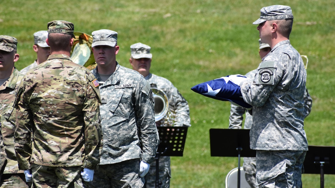 Members of the Iowa National Guard present the flag while conducting Retreat as the 88th Regional Support Command dedicates a plaque at Camp Dodge, Iowa on May 25, in honor of the 88th Infantry Division's beginning there in 1917. During the Command Retreat, Airmen, Soldiers, and Civilians are recognized by Maj. Gen. Timothy Orr, Adjutant General of the Iowa National Guard, for their contributions to the Guard and their communities, state and nation.