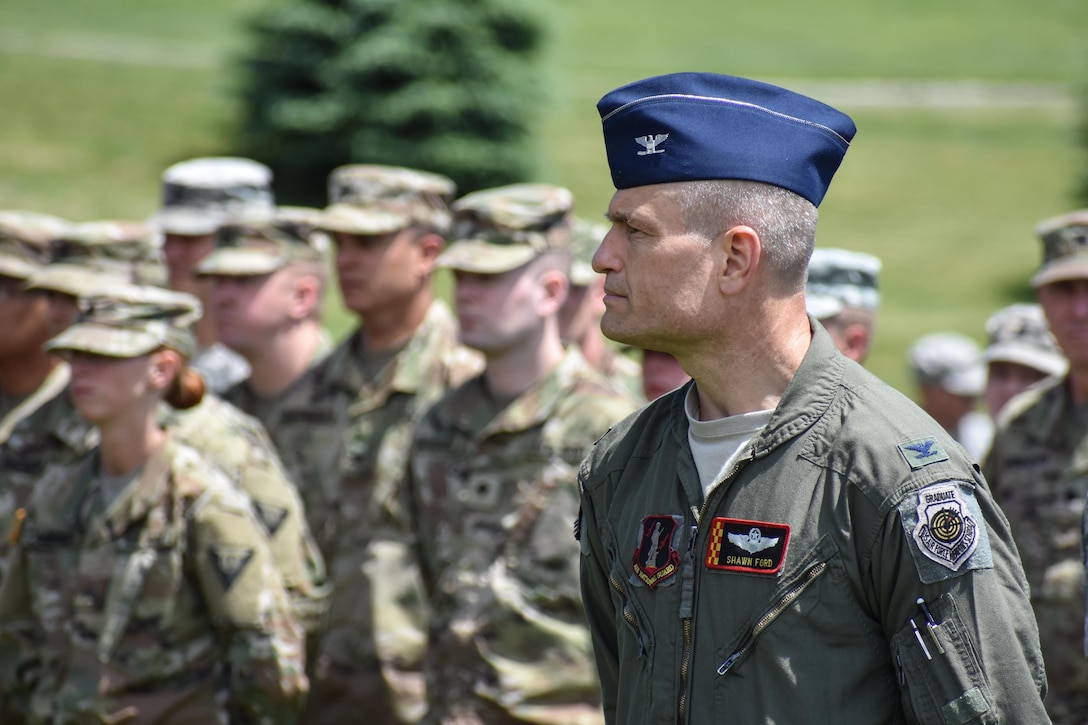 An Airmen in the Iowa National Guard listens as the 88th Regional Support Command dedicates a plaque at Camp Dodge, Iowa on May 25, in honor of the 88th Infantry Division's beginning there in 1917. During the Command Retreat, Airmen, Soldiers, and Civilians are recognized by Maj. Gen. Timothy Orr, Adjutant General of the Iowa National Guard, for their contributions to the Guard and their communities, state and nation.