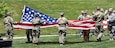 Members of the Iowa National Guard fold the U.S. flag while conducting Retreat as the 88th Regional Support Command dedicates a plaque at Camp Dodge, Iowa on May 25, in honor of the 88th Infantry Division's beginning there in 1917. During the Command Retreat, Airmen, Soldiers, and Civilians are recognized by Maj. Gen. Timothy Orr, Adjutant General of the Iowa National Guard, for their contributions to the Guard and their communities, state and nation.