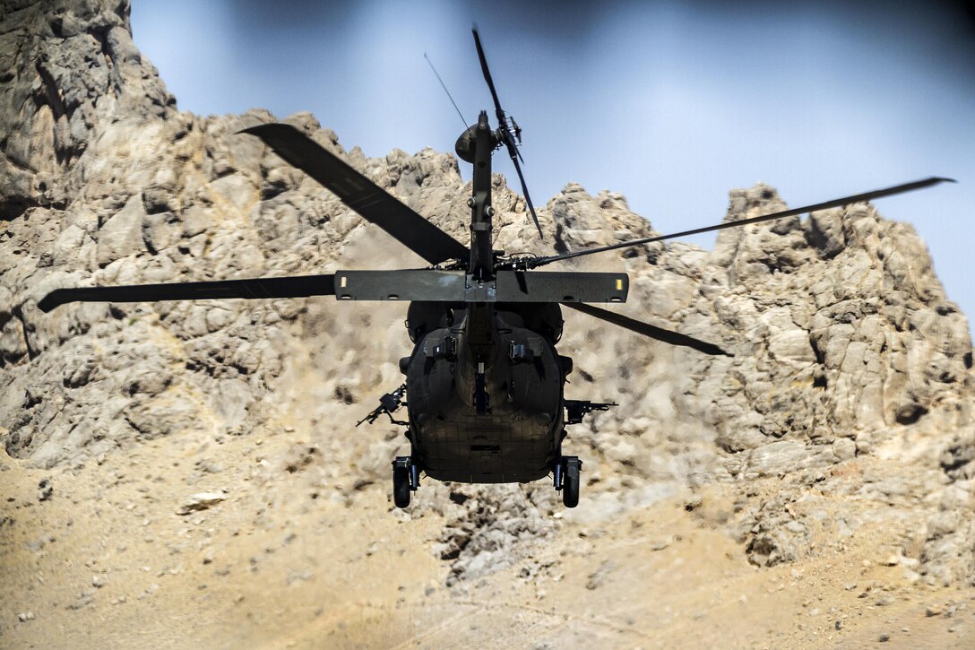 Army pilots fly a UH-60 Black Hawk helicopter on a mission from an undisclosed location near Kandahar Airfield, Afghanistan, May 27, 2017. Army photo by Capt. Brian Harris