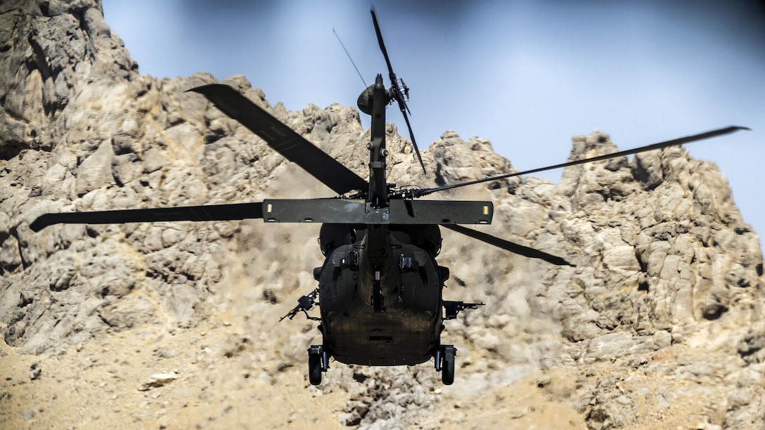 Army pilots fly a UH-60 Black Hawk helicopter on a mission from an undisclosed location near Kandahar Airfield, Afghanistan, May 27, 2017. The pilots are assigned to Task Force Warhawk. Army photo by Capt. Brian Harris