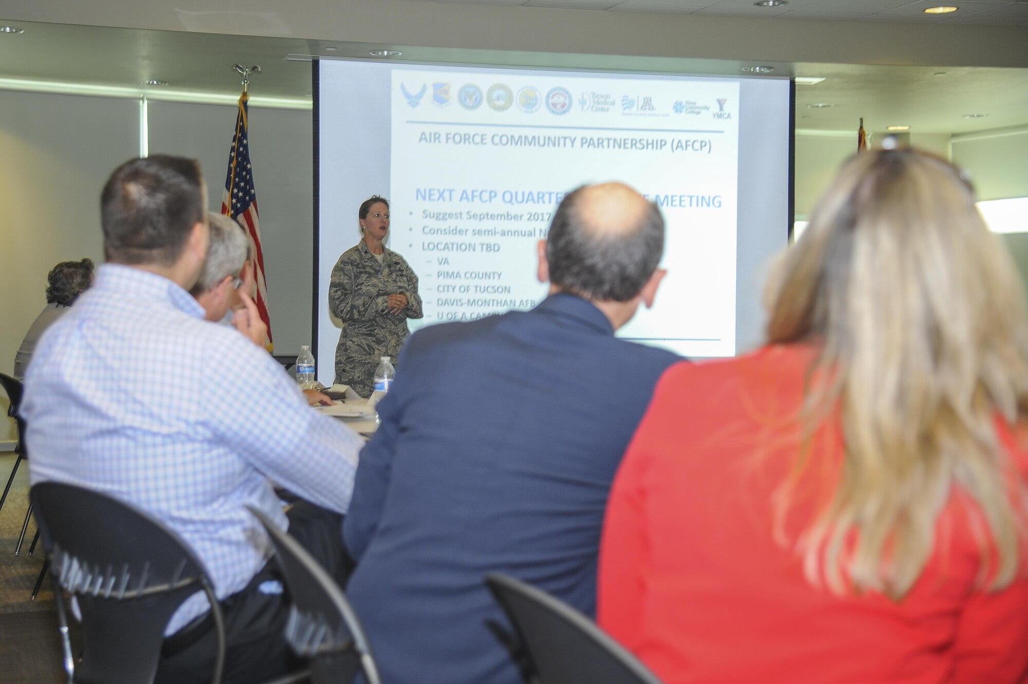 U.S. Air Force Col. Lauren Richter, 355th Mission Support Group commander, gives a briefing during an Air Force Community Partnership meeting at the Pima County Abrams Public Health Center in Tucson, Ariz., May 25, 2017. The meeting included budget briefings on current and future local projects as well as the history behind the coalition between Davis-Monthan Air Force Base, Ariz., and the Tucson population. (U.S. Air Force photo by Senior Airman Mya M. Crosby)