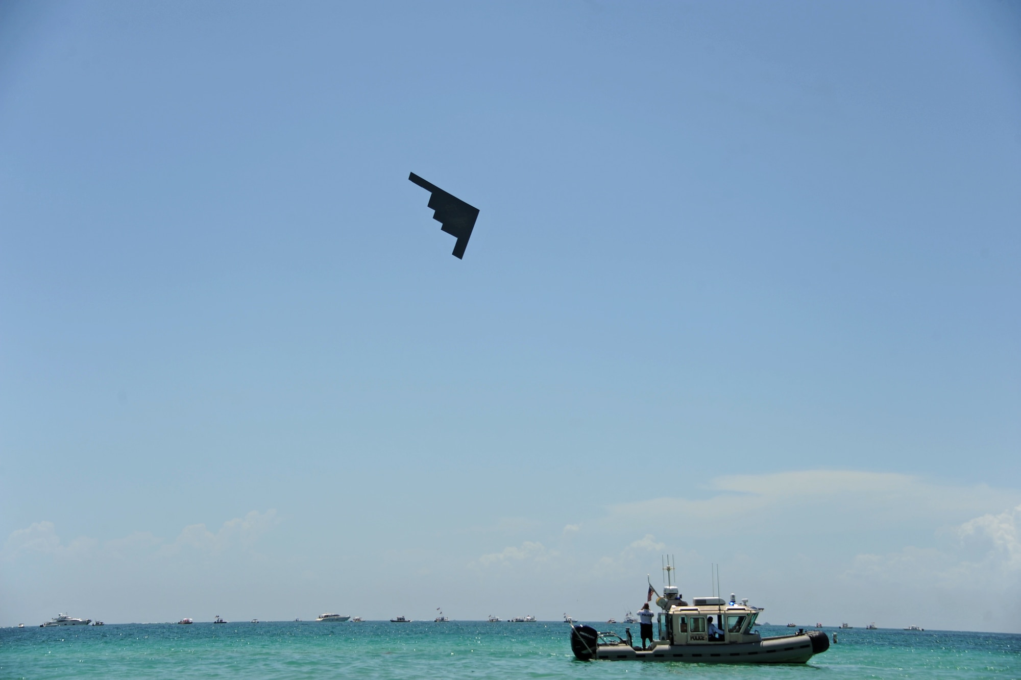 A B-2 Spirit performs a flyover during the Salute to America’s Heroes Air and Sea Show in Miami Beach, Fla., May 27, 2017. Bomber aircraft from Minot Air Force Base, Ellsworth AFB, Dyess AFB, and Whiteman AFB, performed flyover demonstrations to allow the public to witness the capabilities of all three bomber platforms over the course of one airshow, and to generate awareness of each aircraft’s mission. (U.S. Air Force photo by Senior Airman Erin Trower)