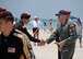 Maj. Gen. Thomas Bussiere, Eighth Air Force commander, receives a ceremonial baton from the U.S. Army Golden Knights Parachute Team during the Salute to America’s Heroes Air and Sea Show in Miami Beach, Fla., May 28, 2017. Members representing all branches of the U.S. Armed Forces took part in the Memorial Day weekend airshow to increase public awareness and understanding of each branch’s unique mission and capabilities. (U.S. Air Force photo by Senior Airman Erin Trower)