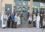 170529-N-ON707-134 FORD ISLAND, Hawaii (May 31, 2017) — Adm. Harry Harris, Commander of U.S. Pacific Command, poses for a photo with friends, family, and coworkers of the late Congressman K. Mark Takai during the dedication ceremony of the K. Mark Takai Pacific Warfighting Center. The center was renamed in honor of Takai for his service and dedication to the U.S. Armed Forces. The K. Mark Takai Pacific Warfighting Center hosts joint and combined training, simulations, mission rehearsals, conferences, worldwide collaboration, and war-game events in support of U.S. Pacific Command. (U.S. Navy photo by Mass Communication 2nd Class James Mullen/Released)