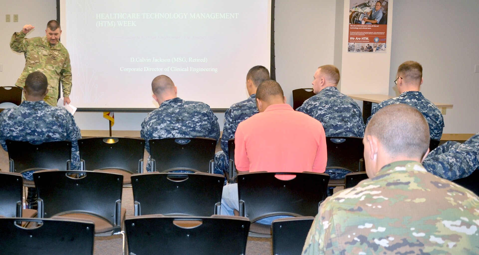 Army Master Sgt. Jarrod Brunson, an instructor at the Medical Education and Training Campus, or METC, speaks to staff, students and instructors from METC at Joint Base San Antonio-Fort Sam Houston as part of Healthcare Technology Management Week. METC instructors from the tri-service biomedical equipment technician, or BMET, program planned daily events to raise awareness during Healthcare Technology Management Week.