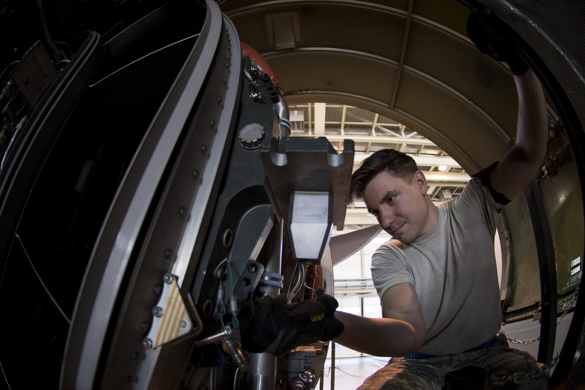 U.S. Air Force Staff Sgt. Amos Hard, 721st Aircraft Maintenance Squadron aerospace propulsion craftsman, matches a cradle mount to the engine of a C-17 Globemaster III at a hangar on Ramstein Air Base, Germany, Oct. 27, 2017. After mounting the engine to the cradle, Hard and his colleagues lowered the engine from the aircraft so they could put a new one in. (U.S. Air Force photo by Senior Airman Devin Boyer)