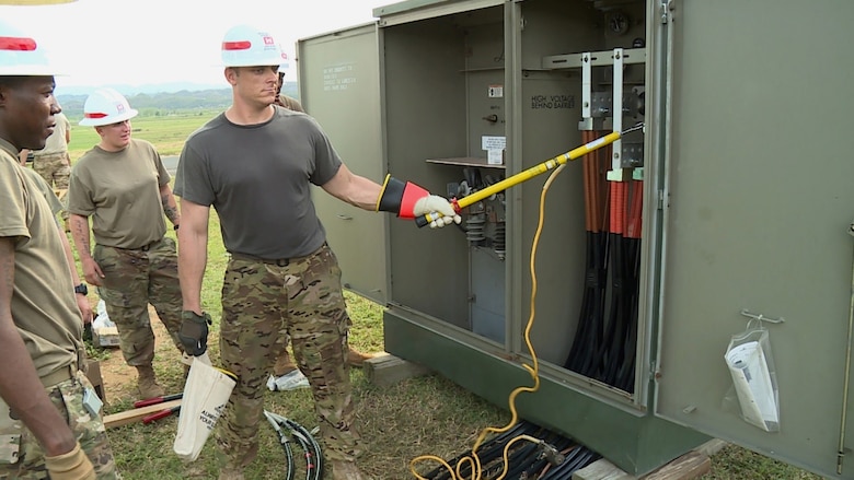 Sgt. Mike Greenwalt, A. Co. 249th Engineer Battalion “Prime Power” ensures all power is discharged from the generator before continuing work on the generator. The generator was installed at the Barceloneta Water Treatment Plant which provides water to a large number of factories in the area. With power restored, factory workers will be able to return to work. (USACE Photo by Mike A. Glasch)