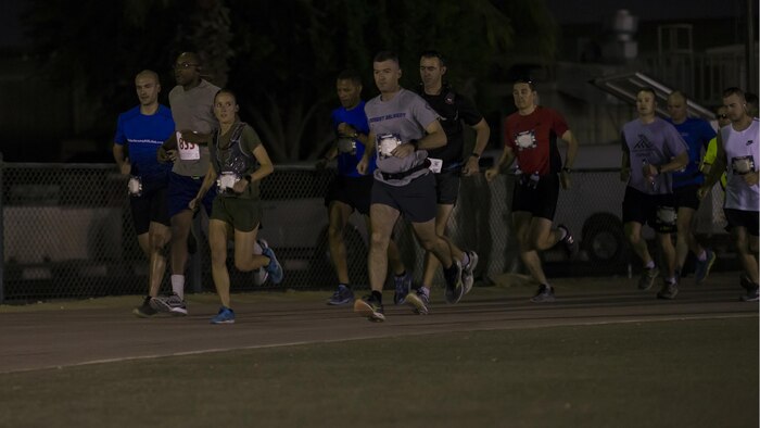 U.S. Marine Capt. Danielle Pozun, Special Purpose Marine Air-Ground Task Force – Crisis Response – Central Command leads the pack at the beginning of the 42nd Marine Corps Marathon while deployed in the Middle East Oct. 22, 2017. The Marine Corps Marathon is one of the largest marathons in the world and hosts the event in forward locations to allow service members outside the United States an opportunity to compete.