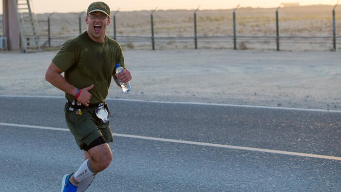 Chief Warrant Officer 2 Jonathan Eaton, mobility officer for Special Purpose Marine Air-Ground Task Force – Crisis Response – Central Command reaches the 10-mile marker of the 42nd Marine Corps Marathon while deployed in the Middle East Oct. 22, 2017. The Marine Corps Marathon is one of the largest marathons in the world and hosts the event in forward locations to allow service members outside the United States an opportunity to compete.
