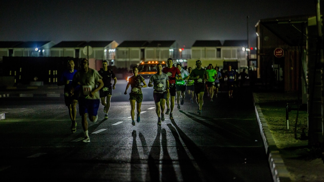 Captain Danielle Pozun (center left) a Marine deployed with Special Purpose Marine Air-Ground Task Force – Crisis Response – Central Command and a member of the Marine Corps Running Team, runs the 42nd Marine Corps Marathon Forward while in the Middle East Oct. 22, 2017. The Marine Corps Marathon is one of the largest marathons in the world and hosts the event in forward locations to allow service members outside the United States an opportunity to compete.