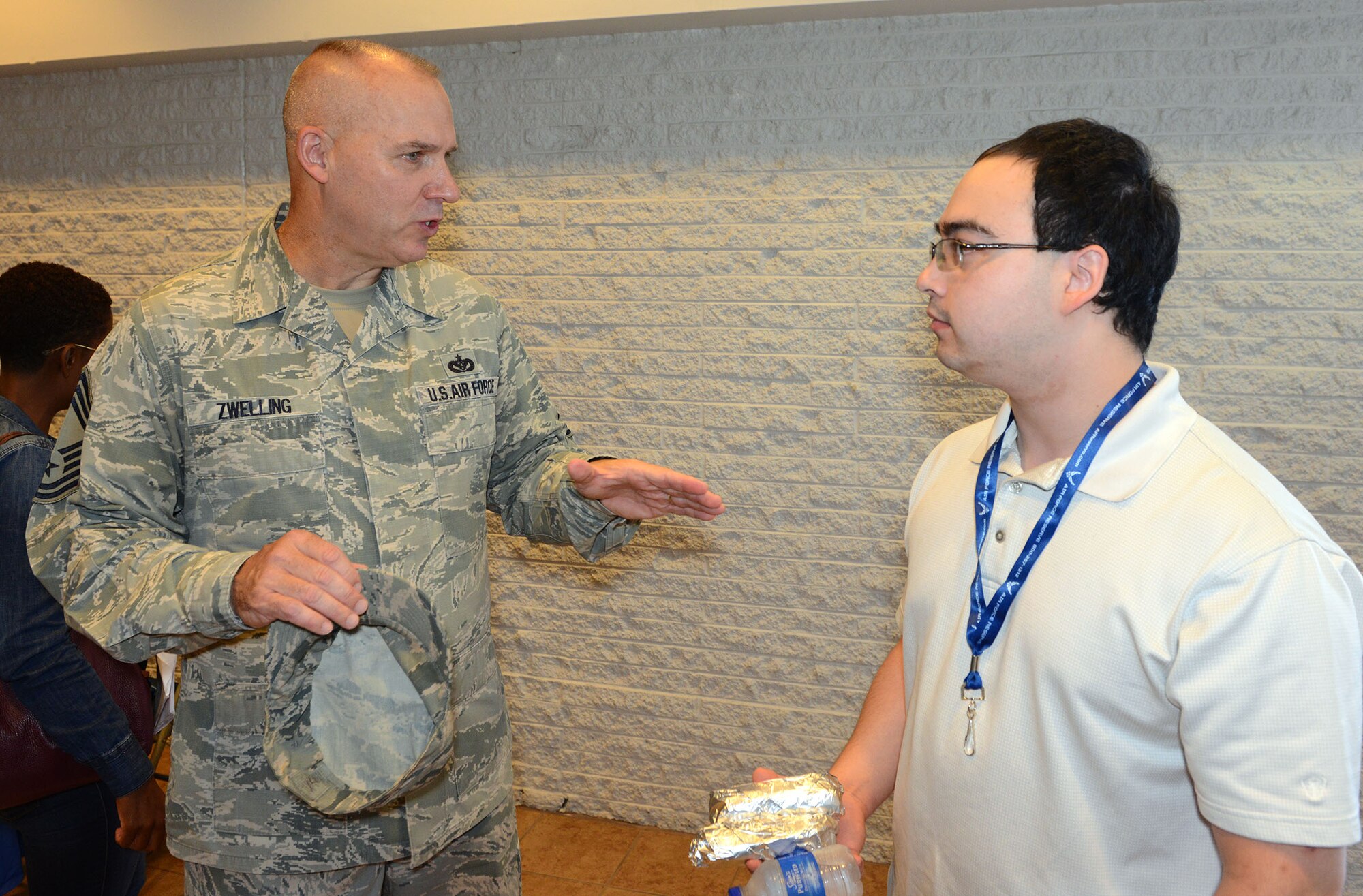 Chief Master Sgt. Thomas Zwelling, Air Force Reserve Command Recruiting Service manager, speaks with an individual ready reserve participant. (U.S. Air Force photo by Master Sgt. Chance Babin)
