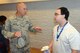 Chief Master Sgt. Thomas Zwelling, Air Force Reserve Command Recruiting Service manager, speaks with an individual ready reserve participant. (U.S. Air Force photo by Master Sgt. Chance Babin)