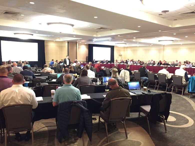 Conference room filled with people.