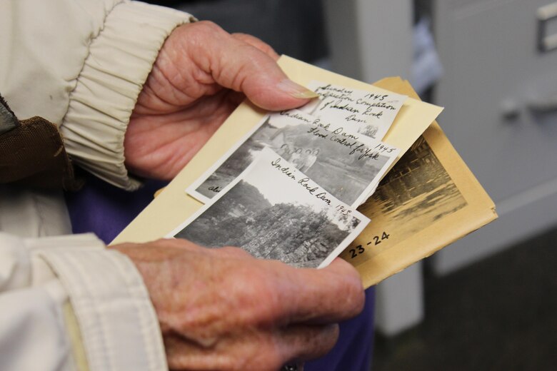 Erma Henry-Raver holds photos of her and relatives going to see Indian Rock Dam in 1945, as well as photo postcards from flood of 1933 in York, Pennsylvania. Henry-Raver was one of several hundred people who attended the 75th anniversary open house celebration of Indian Rock Dam in York, Pennsylvania Saturday October 28, 2017, and one of many that had a personal historic connection to the dam.