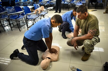 Joint Security Forces and local police forces participate in Subject Matter Expert Exchange to practice life saving techniques for emergency situations.